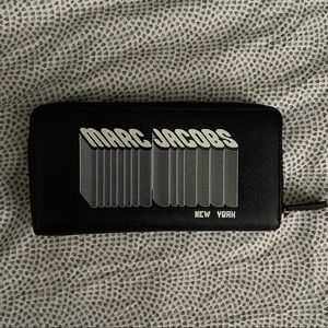 Black Marc Jacobs wallet. Fun logo on front of wallet